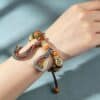 2c34f7d643bba3150b2be4626b203fef The Grounding Guardian: Natural Sheep Horn Handstrung Bracelet