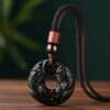 The Abundance Guardian: Natural Obsidian Double Pixiu Peace Buckle Pendant