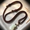 Symbols of Prosperity: Natural Hetian Nephrite Jade Pouch Pendant