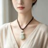Symbols of Prosperity: Natural Hetian Nephrite Jade Pouch Pendant